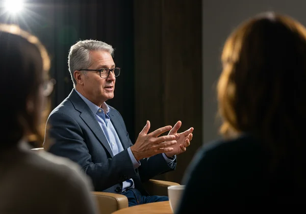 Person confidently advocating for needs in a social setting