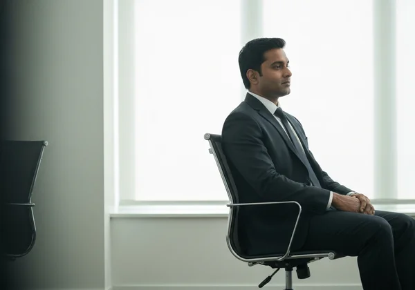 A person managing social energy, taking a quiet moment